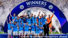 Manchester City players celebrate after winning the Champions League final soccer match against Inter Milan at the Ataturk Olympic Stadium in Istanbul, Turkey, Sunday, June 11, 2023. (AP Photo/Manu Fernandez)