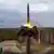 An intercontinental ballistic missile lifts off the ground