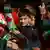 Students wave Canada and Indian flags
