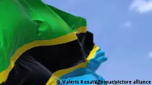25/03/2022 *** Detail of the national flag of Tanzania waving in the wind on a clear day. Tanzania is a country in East Africa. Selective focus.