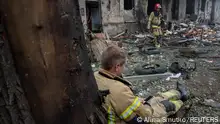 13.06.2023 *** Rescuers are seen at a site of a residential building heavily damaged by a Russian missile strike, amid Russia's attack on Ukraine, in Kryvyi Rih, Dnipropetrovsk region, Ukraine June 13, 2023. REUTERS/Alina Smutko 