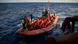 Refugees in a boat are rescued near the Italian coast Refugees in a boat are rescued near the Italian coast