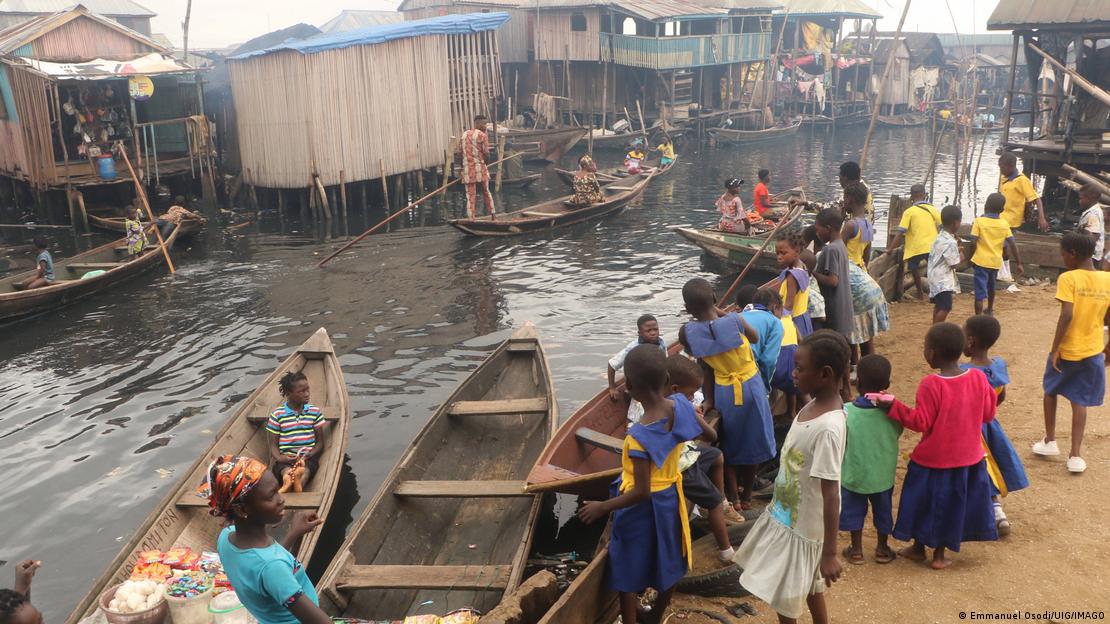 Schoolchildren in Makoko buy food on the waterfront