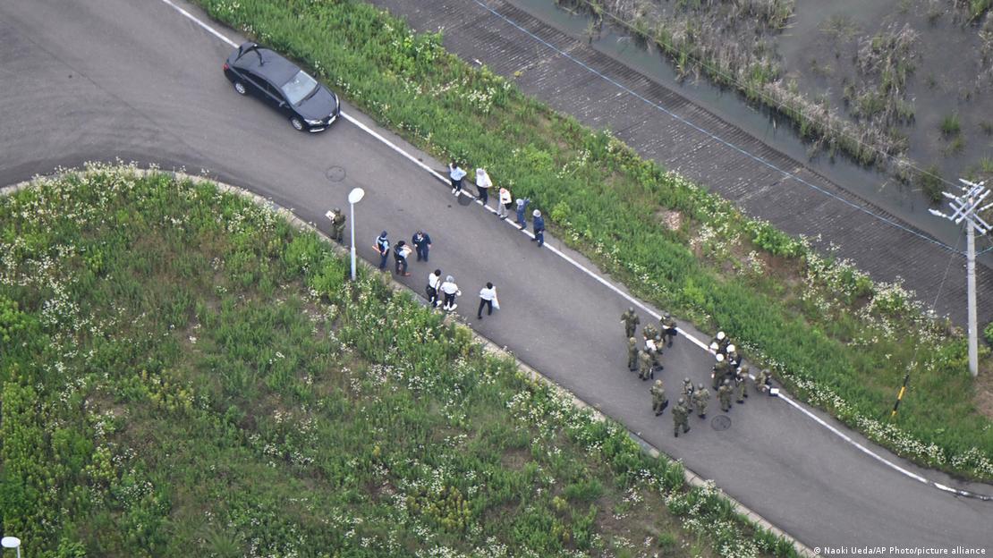 An aerial photo shows Japan Ground Self Defense Force personnel and office officers near Hino Kihon Shagekijo