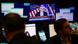 A monitor displays a news conference with Federal Reserve chairman Jerome Powell as traders work on the floor at the New York Stock Exchange in New York A monitor displays a news conference with Federal Reserve chairman Jerome Powell as traders work on the floor at the New York Stock Exchange in New York
