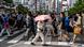 Pedestrians cross a street during hot conditions in the Shinjuku district of Tokyo Pedestrians cross a street during hot conditions in the Shinjuku district of Tokyo