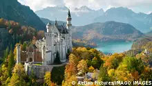 12.10. Hohenschwangau , Deutschland,, Schloss Neuschwanstein castle in Hohenschwangau with Marien bridge, and lake Alpsee and Schloss Hohenschwangau surrounded by colorful trees in autumn on Oct 12, 2022 in Schwangau, Germany.