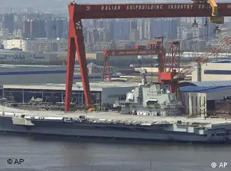 In this photo taken on Aug. 6, 2011, a Chinese aircraft carrier, which had been under refurbishment, is docked at Dalian port in in northeast Liaoning province. China's first aircraft carrier started sea trials Wednesday, Aug. 10, 2011, a step that will likely boost concerns about the country's naval ambitions amid sea territorial disputes. (Foto:Color China Photo/AP/dapd) CHINA OUT
