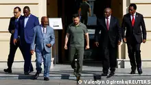 From left to right, Egypt's Prime Minister Mustafa Madbuly, Senegal's President Macky Sall, President of the Union of Comoros Azali Assoumani, Ukraine's President Volodymyr Zelenskiy, South African President Cyril Ramaphosa and Zambia's President Hakainde Hichilema walk to attend a joint press conference