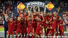 Spain players celebrate with the trophy after winning the Nations League final soccer match between Croatia and Spain at De Kuip stadium in Rotterdam, Netherlands, Sunday, June 18, 2023. (AP Photo/Martin Meissner)