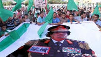 Supporters of Libyan leader Muammar Gaddafi gather for a pro-regime rally