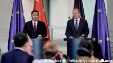 German Chancellor Olaf Scholz, right, and Chinese Premier Li Qiang, brief the media following government consultations of the both countries at the chancellery in Berlin, Germany, Tuesday, June 20, 2023. (AP Photo/Markus Schreiber)