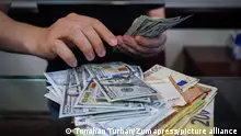 June 13, 2022, Ankara, Turkey: A man in the exchange office counts dollars bills. According to the data published by the Turkish Statistical Institute (Tâ¹?K) on June 3, annual inflation was determined as 73.50. Inflation in Turkey has reached its highest level since October 1998. While the rise in inflation is reflected in the prices of food, electronics and similar consumer goods, the main reason for the rise is seen as the depreciation of the Turkish Lira against foreign currencies. As of June 13, 1 dollar is 17 Turkish liras and 1 euro is 18 Turkish liras. (Credit Image: © Tunahan Turhan/SOPA Images via ZUMA Press Wire