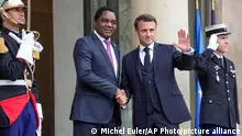 FILE - Zambian President Hakainde Hichilema, left, is greeted by French President Emmanuel Macron at the Elysee Palace in Paris, May 10, 2023. The French government says Thursday, June 22, that Zambia has reached a deal with China and several other government creditors to restructure $6.3 billion in loans. (AP Photo/Michel Euler, File)