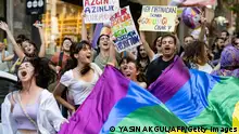 LGBTQ community members and supporters hold rainbow-colored flags and shout slogans during the unauthorized Pride March in Istanbul, on June 25, 2023. (Photo by YASIN AKGUL / AFP) (Photo by YASIN AKGUL/AFP via Getty Images)