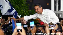 Leader of Greece's conservative party New Democracy Kyriakos Mitsotakis reacts with supporters during an election evening event after general elections in central Athens, on June 25, 2023. Greece's Conservative leader won the country's national elections on June 25 with a clear majority, clinching a second term with what he called a strong mandate that would allow his party to govern alone. In an election one month prior, his party fell short of five seats in parliament to be able to form a single-party government. (Photo by ARIS MESSINIS / AFP) (Photo by ARIS MESSINIS/AFP via Getty Images)