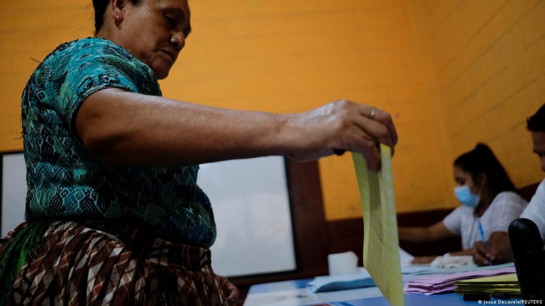A woman casts her vote