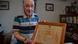 French ex-Resistance fighter Edmond Reveil poses with his "franc-tireur" diploma French ex-Resistance fighter Edmond Reveil poses with his "franc-tireur" diploma