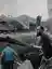 Чоловіки розбирають завали після ракетного удару РФ по піцерії у Краматорську