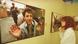 A young woman in 1993 looks at a photo of a Bosnian prisoner that is part of a photo exhibit on the war in the former Yugoslavia A young woman in 1993 looks at a photo of a Bosnian prisoner that is part of a photo exhibit on the war in the former Yugoslavia