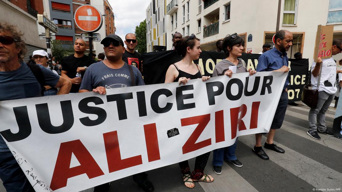 A sign reads ‘Justice for Ali Ziri' at a demonstration in Paris on June 17, 2017