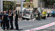 Members of Israeli security and emergency personnel work at the site of a reported car ramming attack in Tel Aviv on July 4, 2023. The suspected attack has resulted in injuries police and medics said, on the second day of a major Israeli army operation in the occupied West Bank. (Photo by JACK GUEZ / AFP) (Photo by JACK GUEZ/AFP via Getty Images)