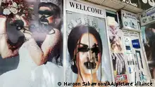 ARCHIV 2021****KABUL, AFGHANISTAN - AUGUST 20: Women posters on beauty salon windows remain vandalized in Kabul, Afghanistan on August 20, 2021. Haroon Sabawoon / Anadolu Agency