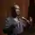 David Adjaye: Man speaking into microphone.