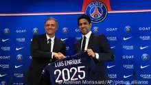 Newly named PSG coach Luis Enrique, left, shakes hands with PSG president Nasser Al-Khelaifi during a press conference at the new Paris-Saint-Germain training ground Wednesday, July 5, 2023 in Poissy, west of Paris. Paris Saint-Germain fired coach Christophe Galtier after a disappointing season on and replaced him with former Spain and Barcelona manager Luis Enrique. (AP Photo/Aurelien Morissard)
