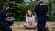 Greta Thunberg photographed while sitting on the ground between two Swedish police officers Greta Thunberg photographed while sitting on the ground between two Swedish police officers