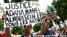 A participant holds a placard during the March for Adama Traore - seven years after his death - at Place de la Republique, in Paris on July 8, 2023. Seven years after Adama Traore, a young black man, died in police custody, his sister had planned to lead a commemorative march north of Paris in Persan and Beaumont-sur-Oise.
However, with tensions still high following the police killing of 17-year-old Nahel, of Algerian origin, at a traffic stop last week, a court ruled the chance of public disturbance was too high to allow the march to proceed. (Photo by Bertrand GUAY / AFP) (Photo by BERTRAND GUAY/AFP via Getty Images)