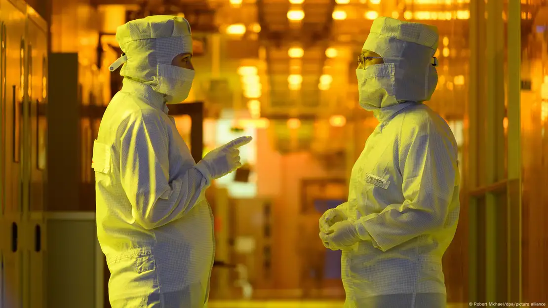 Two employees at German chipmaker Infineon's factory 