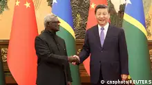 Chinese President Xi Jinping and Solomon Islands Prime Minister Manasseh Sogavare shake hands at the Great Hall of the People in Beijing, China July 10, 2023. cnsphoto via REUTERS ATTENTION EDITORS - THIS IMAGE WAS PROVIDED BY A THIRD PARTY. CHINA OUT. 