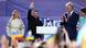 Ukrainian President Volodymyr Zelenskyy (center, hand raised) greets cheering supporters in Vilnius, Lithuania, alongside his wife Olena (left), Lithuanian President Gitanas Nauseda (right) and First Lady Diana Ukrainian President Volodymyr Zelenskyy (center, hand raised) greets cheering supporters in Vilnius, Lithuania, alongside his wife Olena (left), Lithuanian President Gitanas Nauseda (right) and First Lady Diana