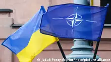 Flags of Ukraine and NATO are seen, while the NATO Summit is held in the city, in Vilnius, Lithuania on July 11, 2023. (Photo by Jakub Porzycki/NurPhoto)