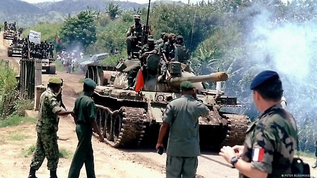 Some of the 700 Ugandan Peoples Defence Force ( UPDF) troops are met by military attaches, upon arrival from the Democratic Republic of Congo in a convoy of military tanks