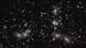 Los astrónomos estiman que 50.000 fuentes de luz infrarroja cercana están representadas en esta imagen del telescopio espacial James Webb de la NASA. Los astrónomos estiman que 50.000 fuentes de luz infrarroja cercana están representadas en esta imagen del telescopio espacial James Webb de la NASA.
