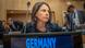 Annalena Baerbock sits in front of a podium Annalena Baerbock sits in front of a podium