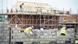 Builders working on a residential construction site Builders working on a residential construction site