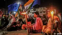 18/07/2023**Women holding Indian national and United nation's flags take part in a demonstation demanding for the restoration of peace in India's north-eastern Manipur state, in Imphal on July 18, 2023, following ongoing ethnic violence in the state. (Photo by AFP)