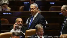 Israel's Prime Minister Benjamin Netanyahu (C) attends a session at the Parliament in Jerusalem on July 24, 2023, amid a months-long wave of protests against the government's planned judicial overhaul. Israeli lawmakers on July 24 prepared for a final vote on a major component of the hard-right government's controversial judicial reforms even as US President Joe Biden called for postponing the divisive bill that has triggered mass protests. (Photo by RONALDO SCHEMIDT / AFP) (Photo by RONALDO SCHEMIDT/AFP via Getty Images)