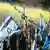 Con banderas de Israel y cornetas los manifestantes salieron a las calles a protestar contra la reforma judicial.