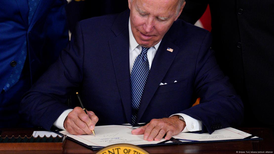 U.S. President Joe Biden signs into law the Inflation Reduction Act in the State Dining Room at the White House in Washington on August 16, 2022.