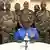 Colonel-Major Amadou Abdramane, entouré de neuf militaires, à l'ORTN