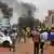 Supporters of the Nigerien security forces attack the headquarters of President Mohamed Bazoum's party in Niamey 