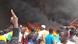 Protesters outside a large fire in Niamey, Niger Protesters outside a large fire in Niamey, Niger