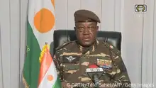 28/07/2023 *** TOPSHOT - This video frame grab image obtained by AFP from ORTN - Télé Sahel on July 28, 2023 shows General Abdourahamane Tchiani, Niger's new strongman, speaking on national television and reads a statement as President of the National Council for the Safeguarding of the Fatherland, after the ouster of President-elect Mohamed Bazoum. The chief of the Presidential Guard justifies the coup by evoking the continued deterioration of the security situation in the country, as well as poor economic and social governance. (Photo by ORTN - Télé Sahel / AFP) (Photo by -/ORTN - Télé Sahel/AFP via Getty Images)