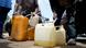 People sell black market fuel on the street in Lagos, Nigeria, Tuesday, May 30, 2023. People sell black market fuel on the street in Lagos, Nigeria, Tuesday, May 30, 2023.