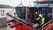 A team of scientists and workers lower the wooden rudder of a 400-year-old ship onto the deck of a specialized vessel in the Trave River near Lübeck, Germany A team of scientists and workers lower the wooden rudder of a 400-year-old ship onto the deck of a specialized vessel in the Trave River near Lübeck, Germany