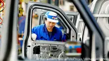 ©ChinaFotoPress/MAXPPP - JIUJIANG, CHINA - NOVEMBER 10: (CHINA OUT) Employees work on the production line at Changhe Suzuki Automobile Co.,Ltd on November 10, 2011 in Jiujiang, Jiangxi Province of China. China:'s automobile sales dropped 7.37percent month-on-month to 1.52 million units in October, according to the China Association of Automobile Manufacturers (CAAM) on Wednesday. (Photo by Hu Guolin/ChinaFotoPress)***_***422959853